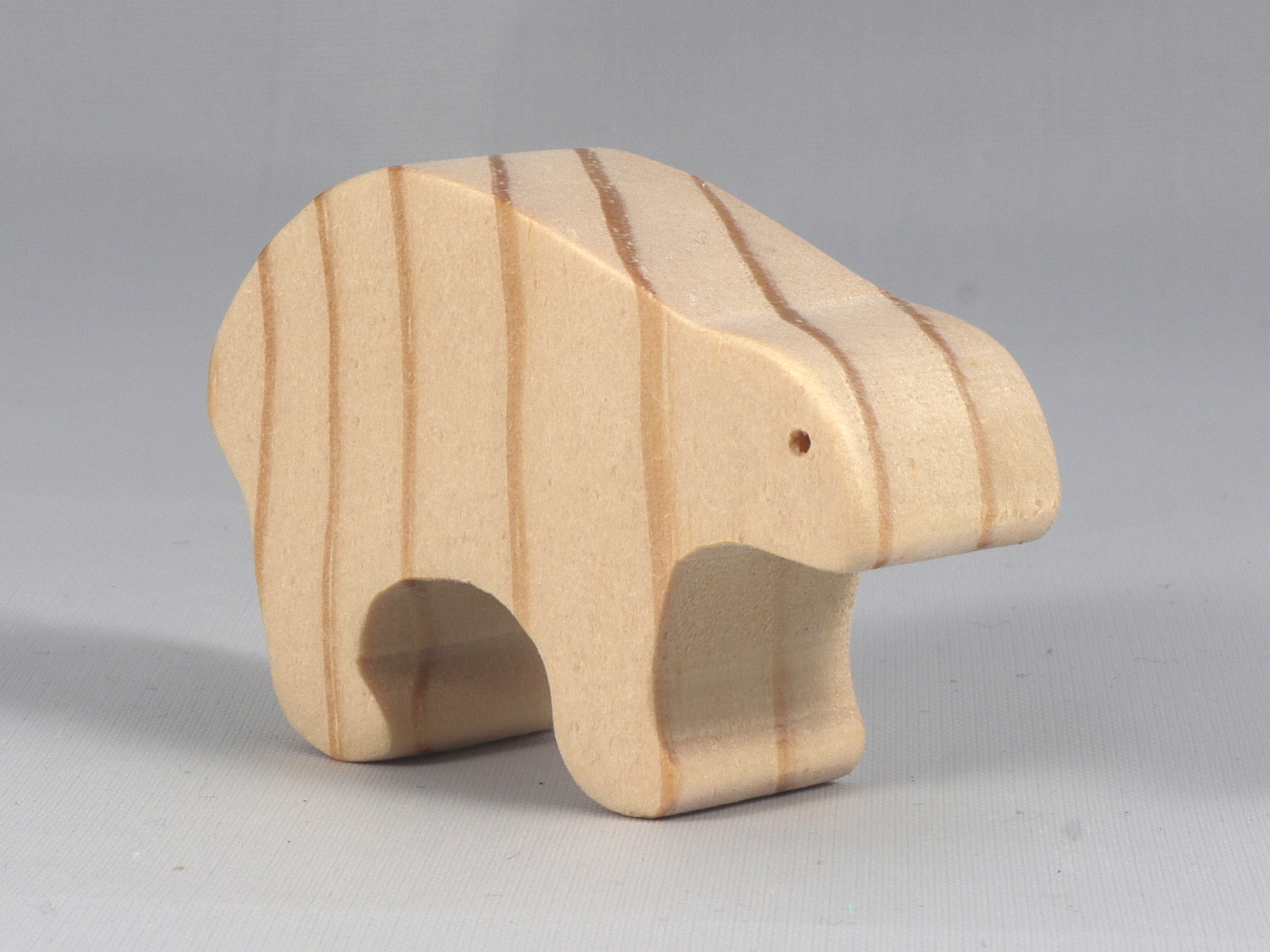 This wooden toy bear is a part of my Itty Bitty Animals Collection and has been handmade in America. It is unfinished, freestanding, and can be stacked. The toy is made using traditional woodworking tools, sanded smooth, and is ready to be painted.