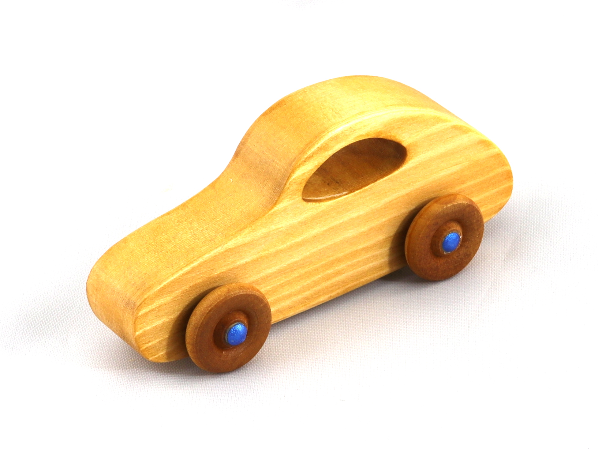 Handmade wooden toy car modeled after the classic 1957 Bug with an amber shellac finish and metallic sapphire blue trim from My Play Pal Collection.