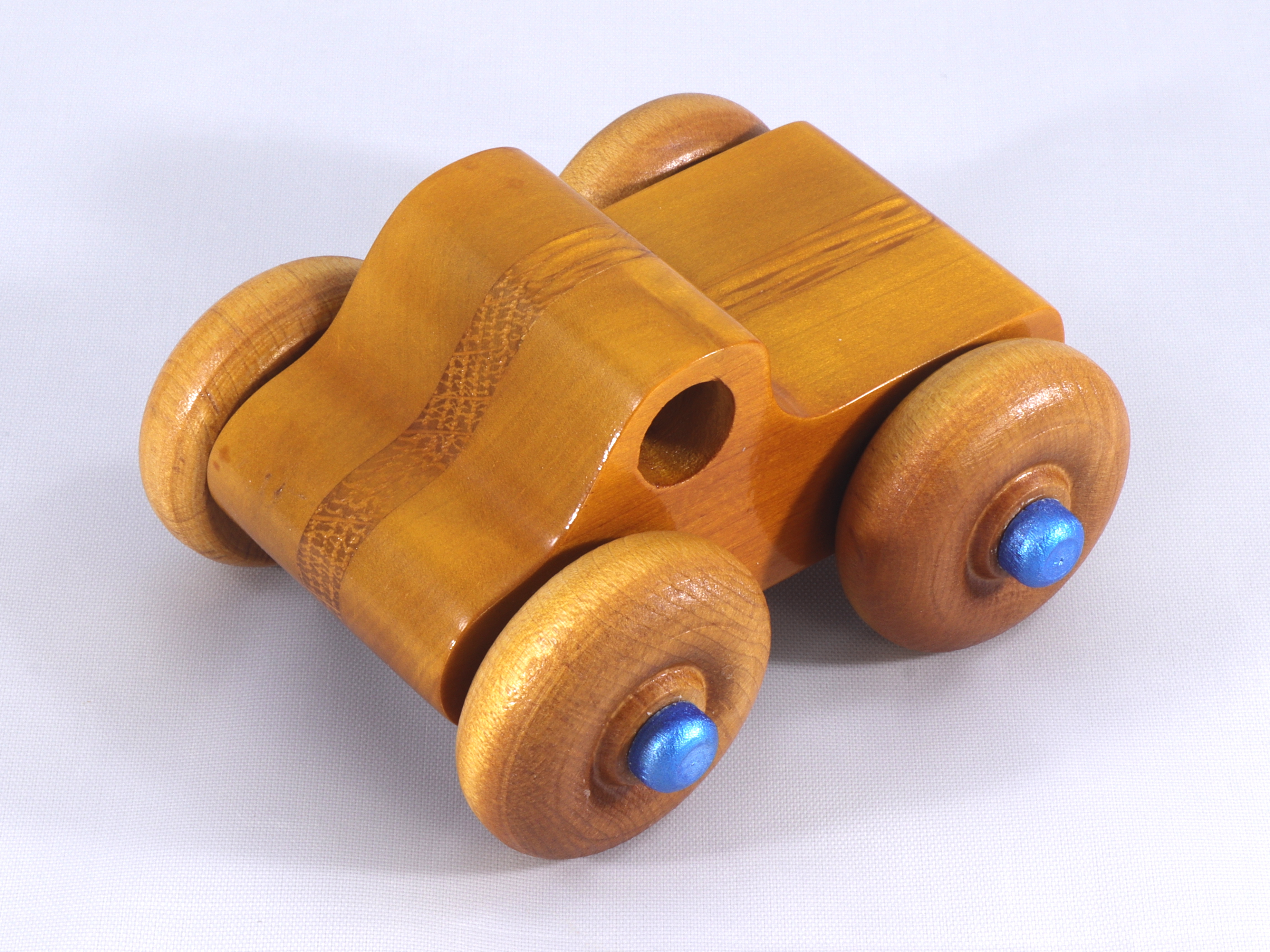 Handmade Wooden Toy Monster Pickup Truck with large wheels Made From Laminated Hardwoods and Finished With Amber Shellac and metallic Sapphire Blue From My Play Pal Collection