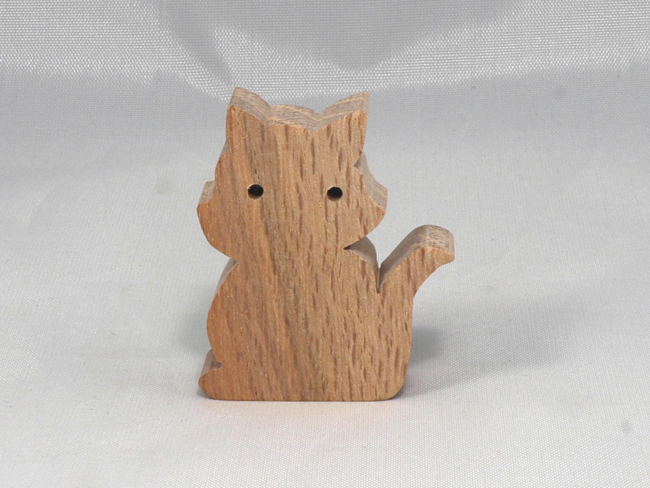 Handmade wood toy kitten cutout made from unfinished wood. It is sanded and ready to paint. It is a freestanding and excellent pretend toy that can also be used for crafts.