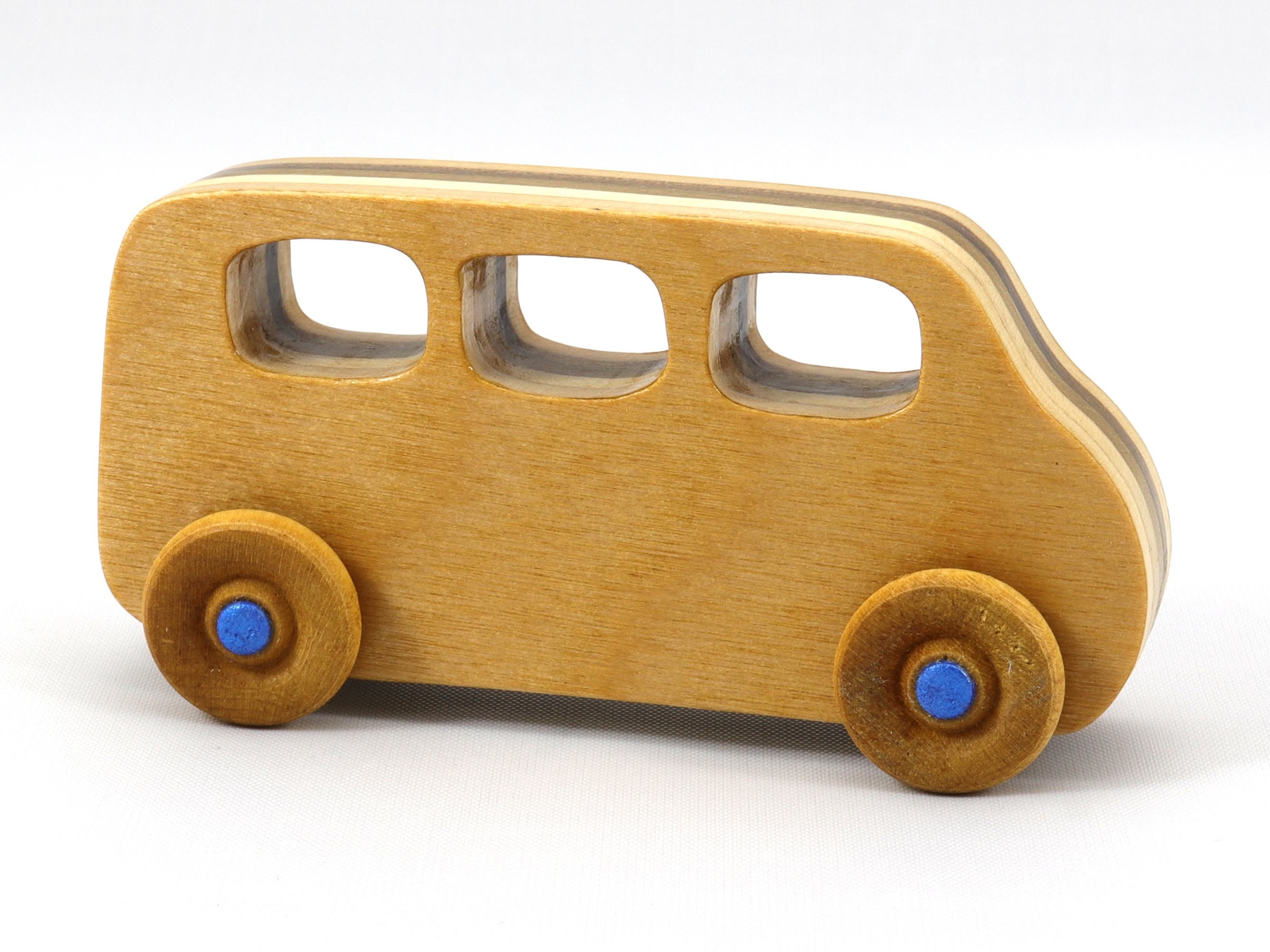 Handmade wood toy minivan made by me in my shop using traditional woodworking tools. It is hand finished with clear shellac with metallic sapphire blue acrylic paint.