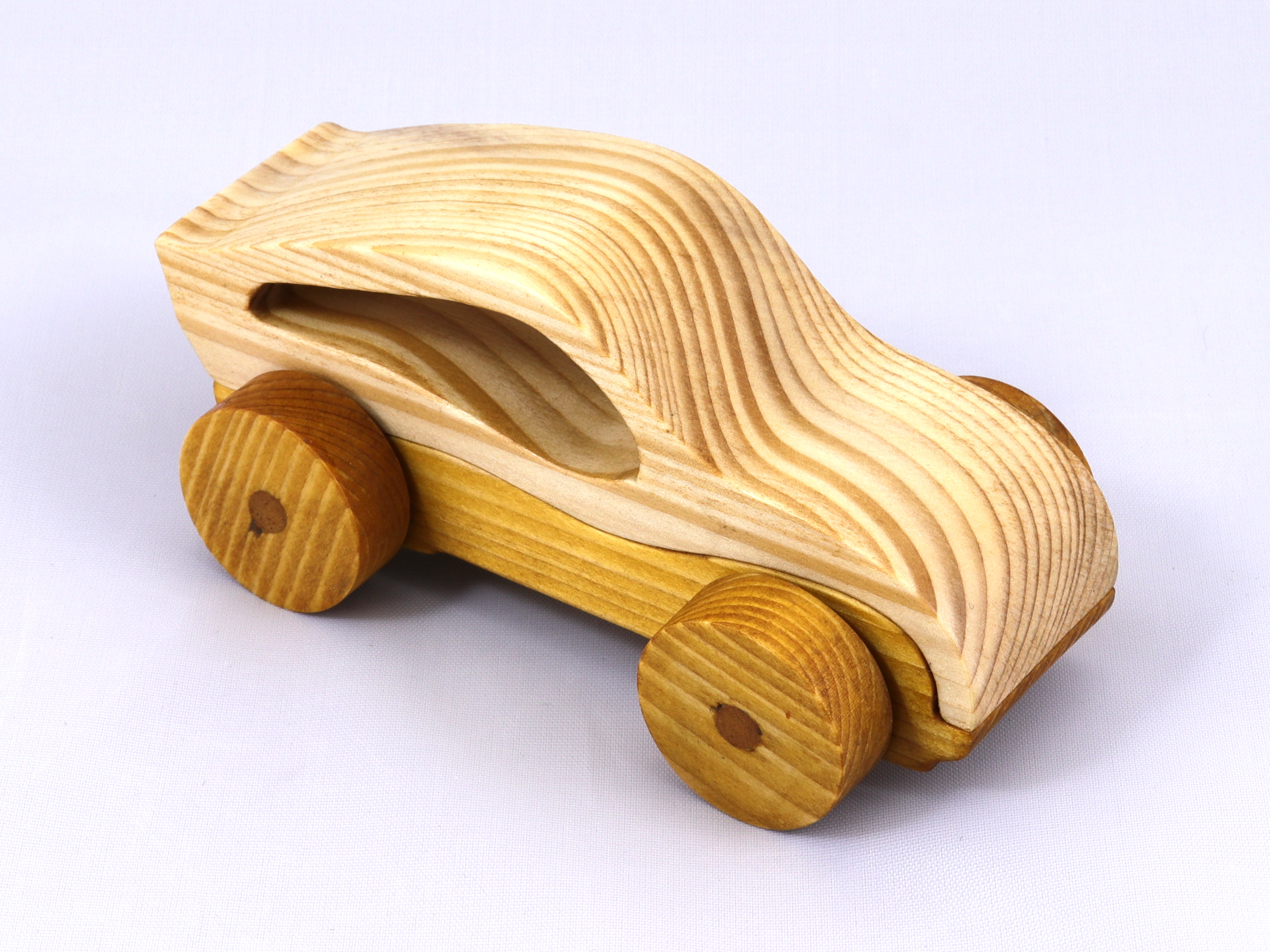 Handmade wooden toy car, two-tone clear and amber shellac finish. Part of my Speedy Wheels Collection.
