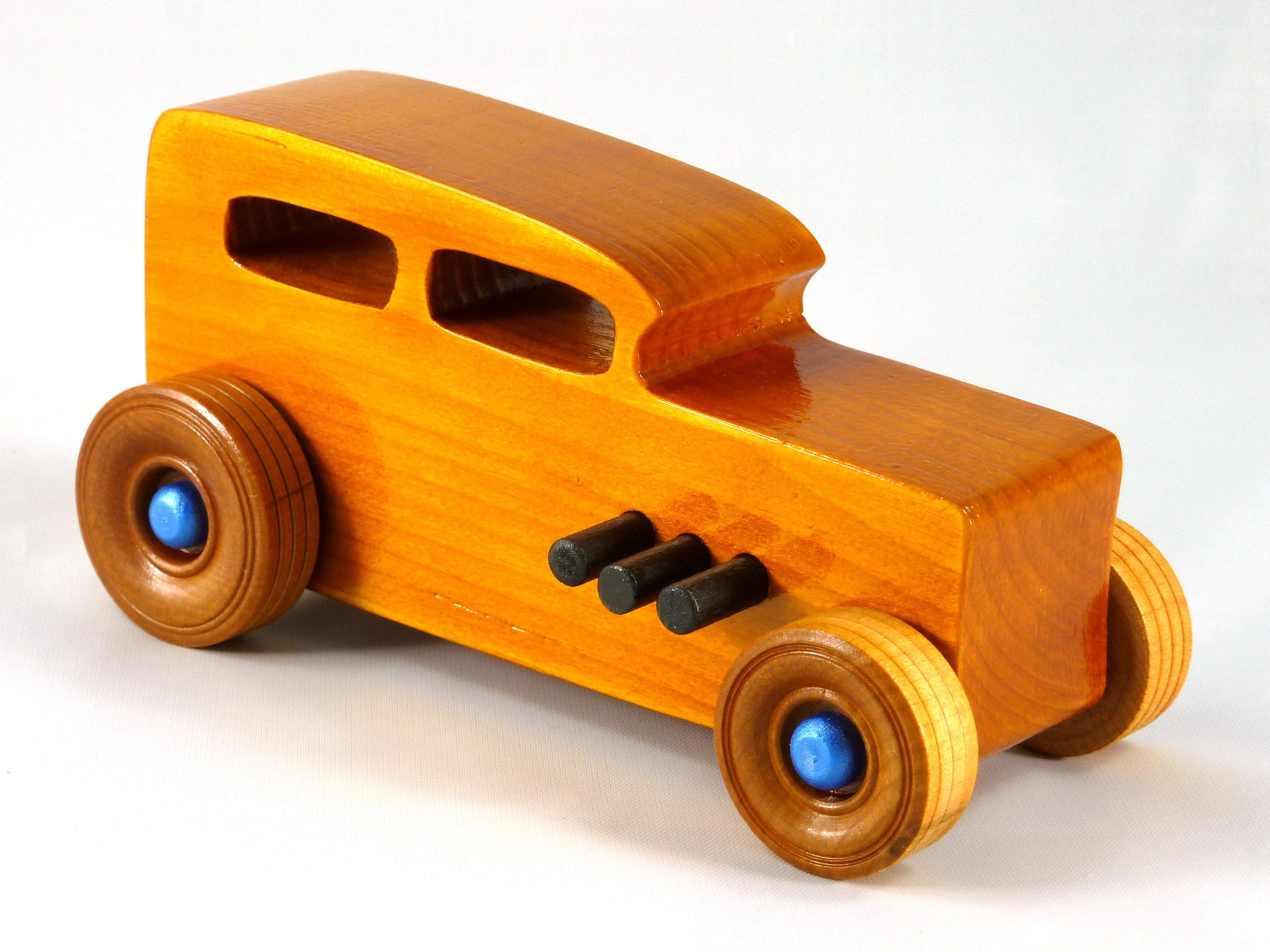 Handmade Wood Toy Car Hot Rod 1932 Sedan Finished With Amber Shellac And Trimmed With Metallic Saphire Blue And Black Acrylic Paint From My Hot Rod Collection