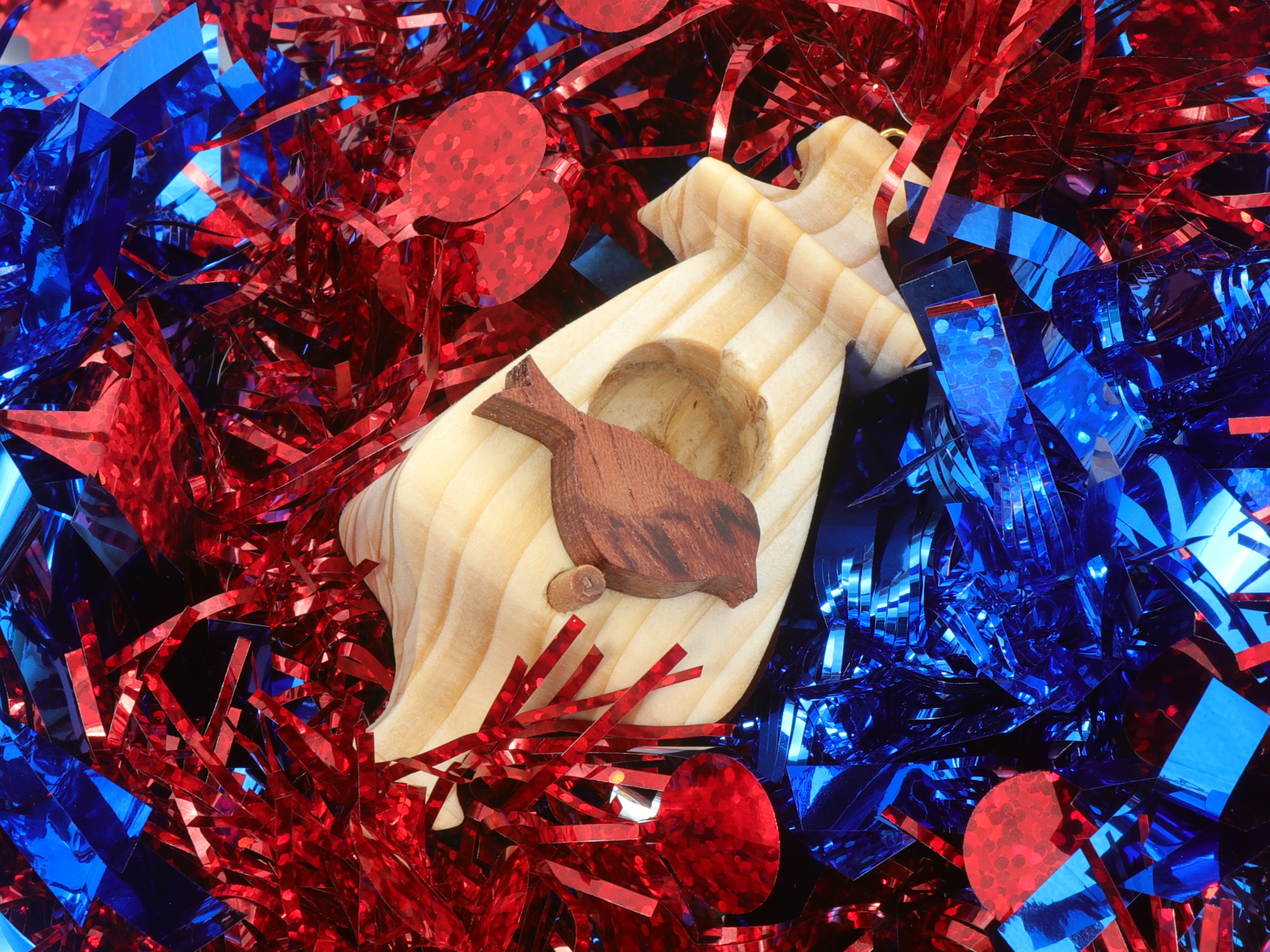 Handmade Wood Miniature Birdhouse Ornament crafted using only the finest select hardwoods and traditional woodworking tools. Each ornament is individually finished with a blend of mineral oil and beeswax to bring out the natural beauty of the wood.