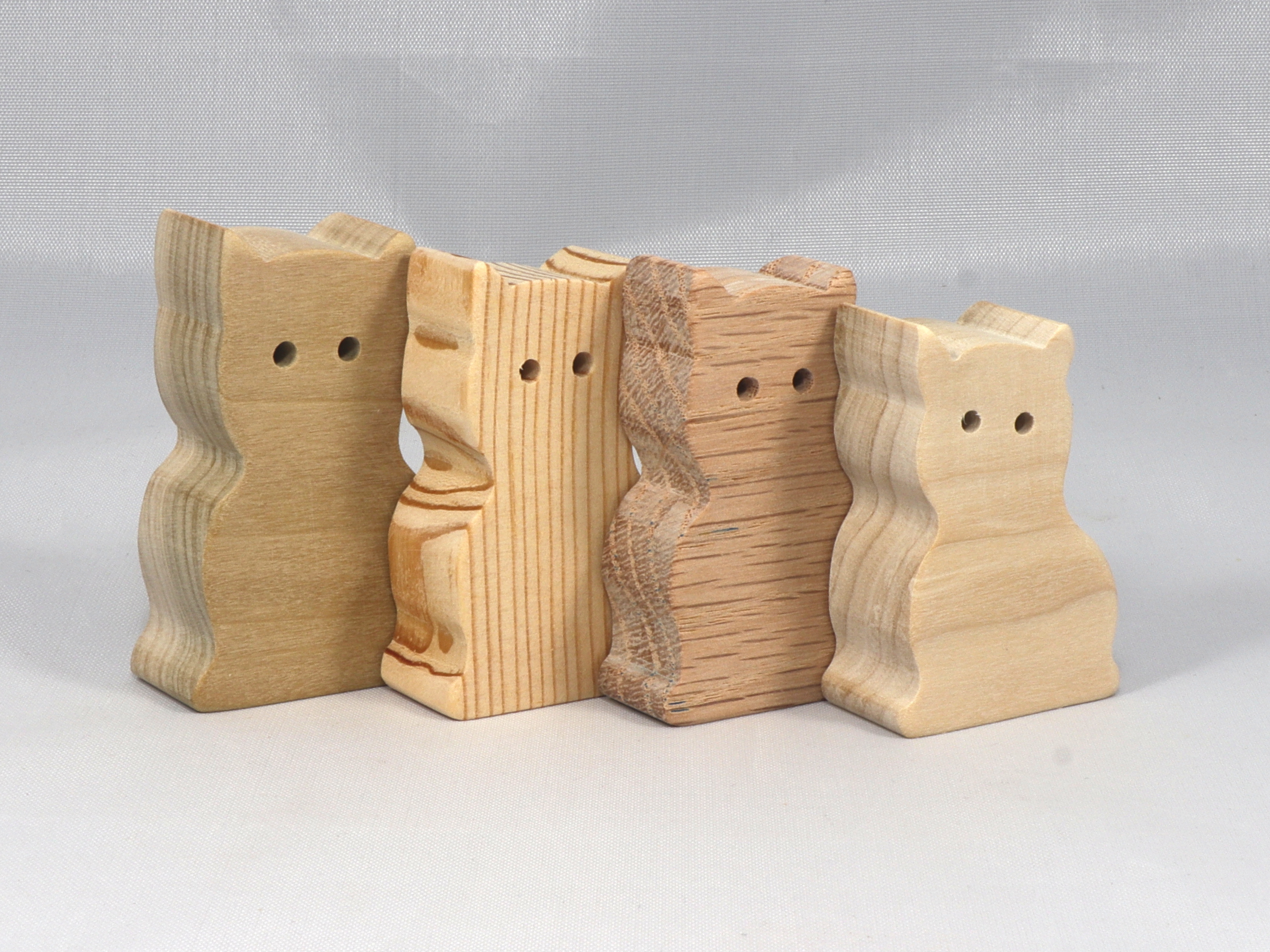 A handmade freestanding wooden toy cat cutout 1/2-3/4 inches thick is made from various kinds of wood sanded smooth and ready to paint. It is excellent for kids' crafts, pretend, or stacking toys. Other sizes are available with a custom order.